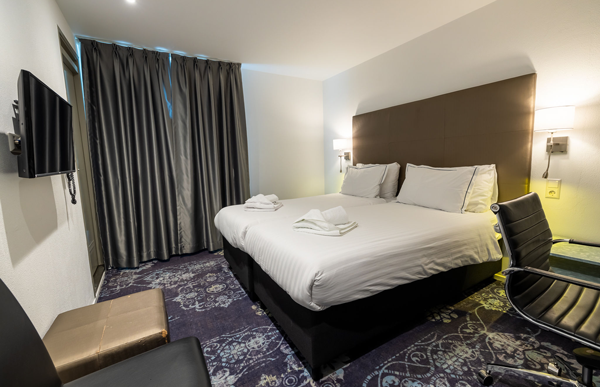 Slaapkamer Hotel Atlas